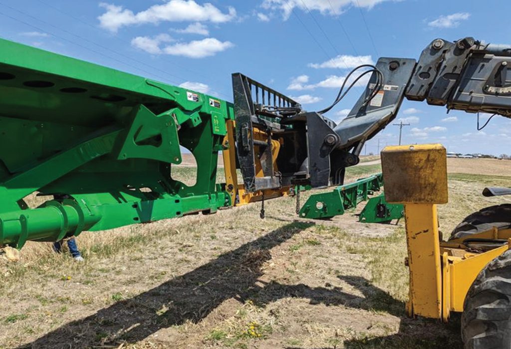 Bish Implement Mover transporting a heavy item with a tractor