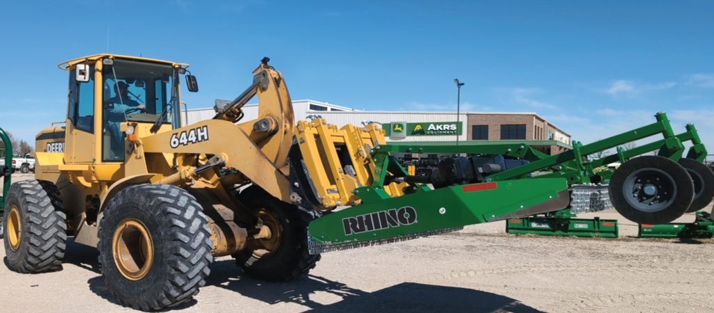 Bish Implement Mover transporting a heavy item with a tractor