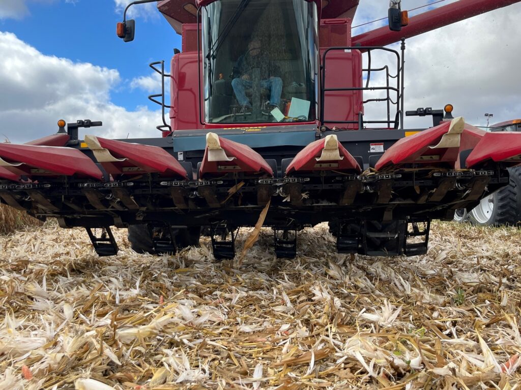 Close-up of heavy-duty Corn Stalk Roller in field