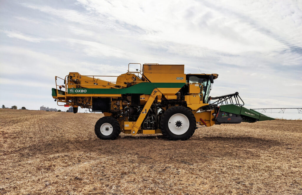 Oxbo combine equipped with Bish Research Header harvesting small research plots