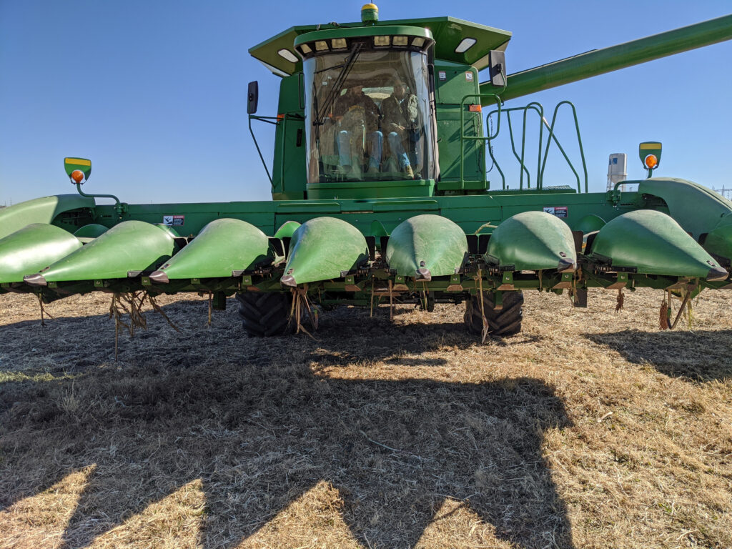 Combine equipped with Bish SuperCrop HCK harvesting row crops