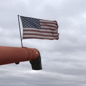 CNH combine unloading auger flag pole mount