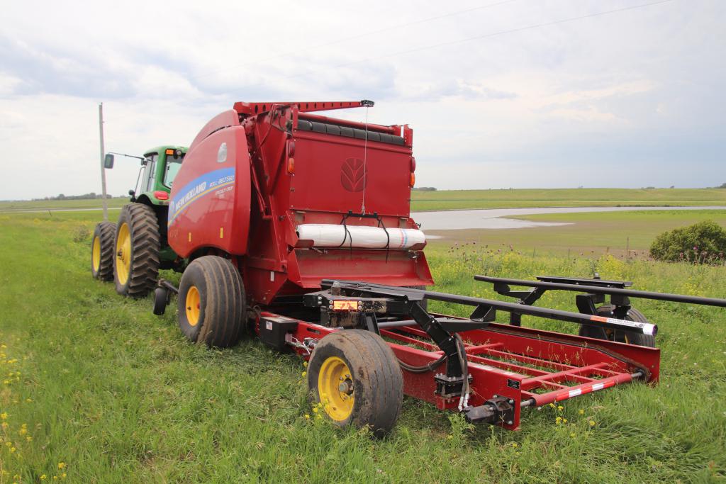 Installed net wrap assist on CNH baler showing wrap guidance and support