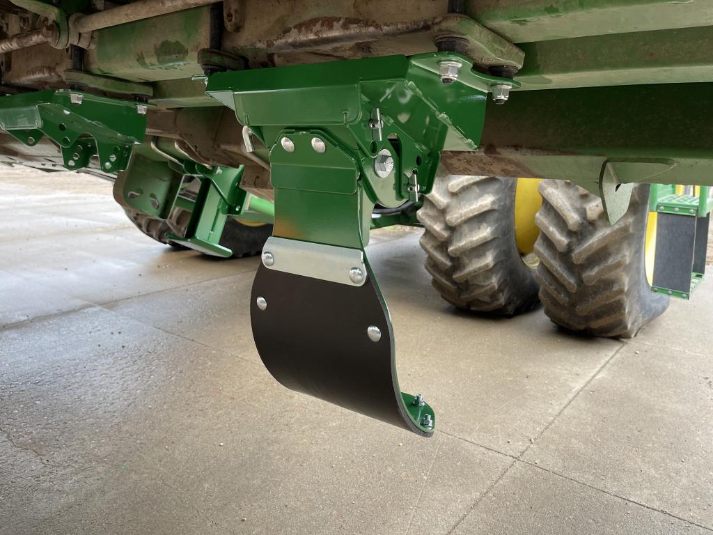Detail of poly stalk deflector mounted on corn head
