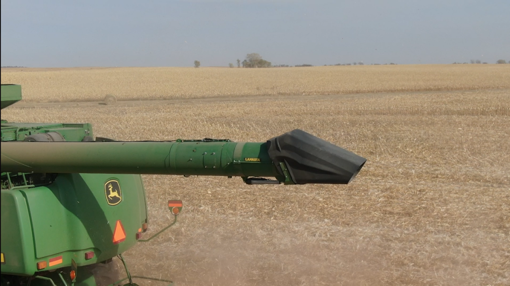 Side view of John Deere tippy spout showing adjustable discharge angle